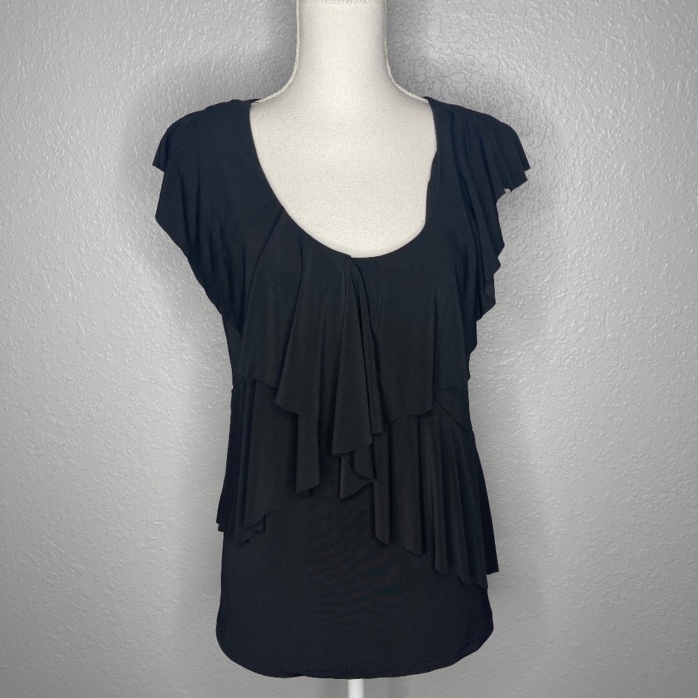 Black tank top‎ with ruffles details .